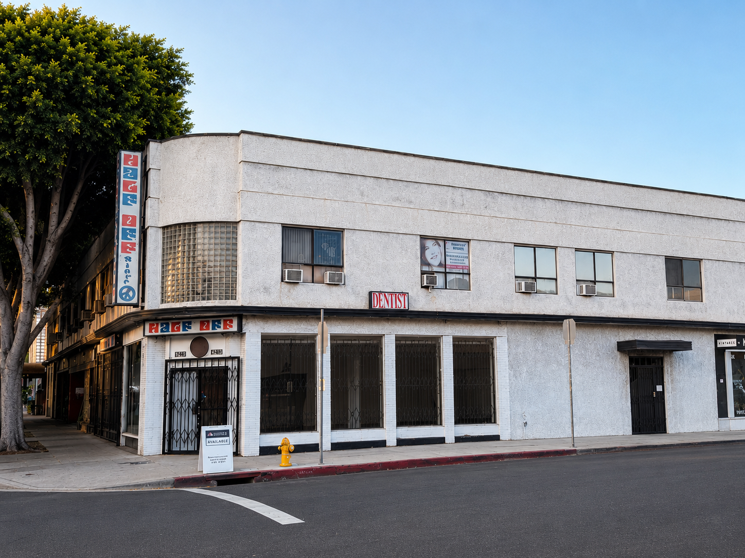 The corner of 1748–1750 N Vermont, dusk.